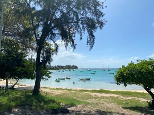 a view of a beach with boats in the water at Just Chill Villa in Trou aux Biches