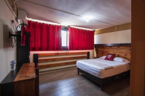 Postel nebo postele na pokoji v ubytování Casa Bonita Hotel y Hostal
