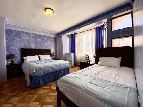 Cama o camas de una habitación en Las Tholas Hotel