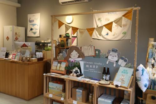 a book store with a sign on the wall at 微光書旅-輕旅 in Tongluo