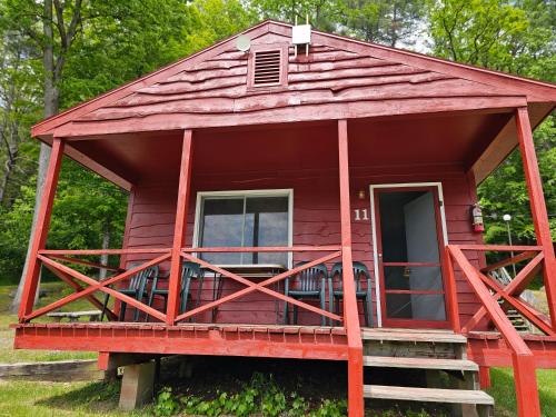 a red tiny house with a red roof at The Gold Eagle in Lake George