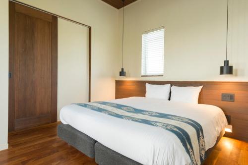 Una cama o camas en una habitación de Mihana Onnason