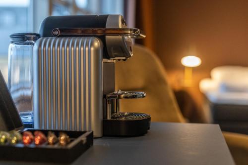 a suitcase sitting on top of a table next to at Pier 5 Hotel in Aalborg