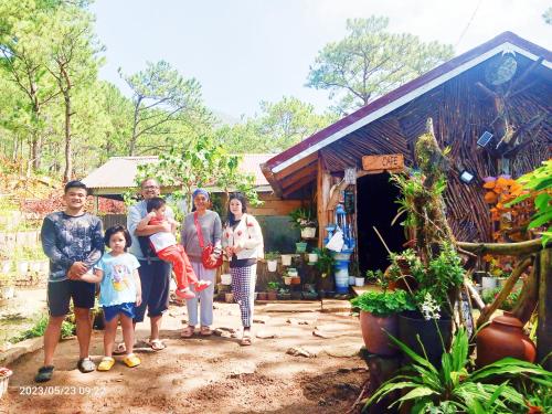 a group of people standing in front of a building at IYAMAN FARM near SAGADA 