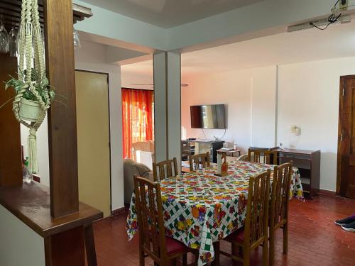 a dining room with a table with chairs and a tableablish at Comoda y amplia casa en Mercedes BsAs in Mercedes