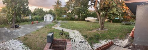 a small backyard with a yard with a house at Hollywood Beach 3 Bedroom Apartment in Hollywood