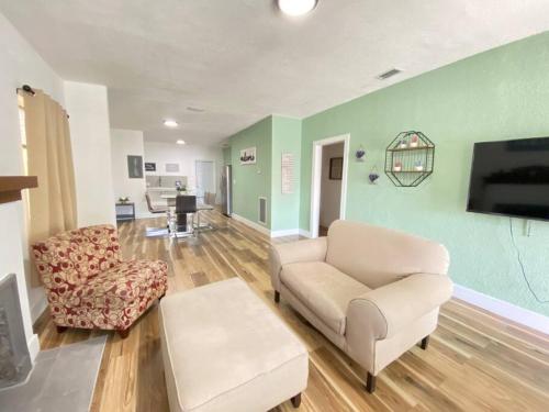 a living room with a couch and a chair at Heart of Miami sleeps 10 near Little Havana Beaches in Miami