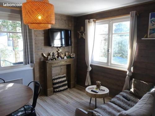 Posezení v ubytování F3 Terrasse & Jardin Font-Romeu