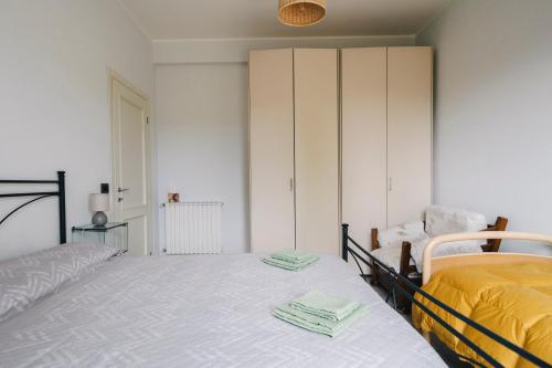 a bedroom with a bed and a cupboard at Il Lampin B&B in Marina di Andora