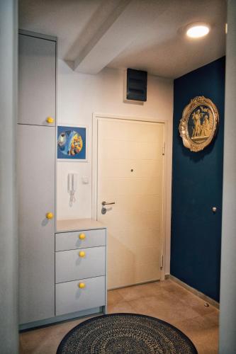 a room with a dresser and a closet with a door at The Impressive Apartment in Trebinje