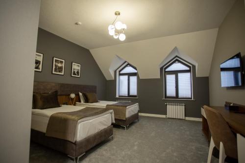 Postel nebo postele na pokoji v ubytování Leon Hotel Spa Ganja