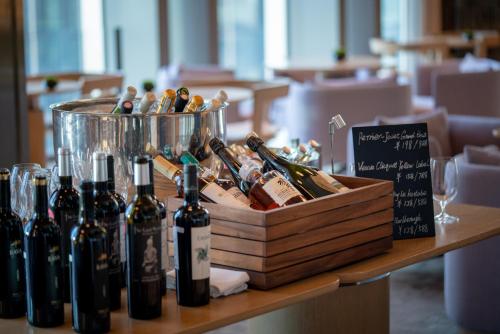 a bunch of bottles of wine on a table at Park Hyatt Shenzhen in Shenzhen