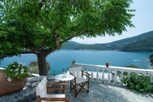a table and chairs with a view of a lake at Nafsika Sea View Apartments in Kerveli
