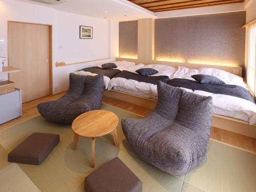 Postel nebo postele na pokoji v ubytování Hotel Fuji