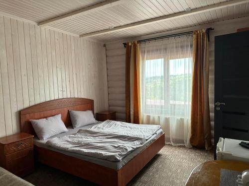 Postel nebo postele na pokoji v ubytování Panorama Karpat