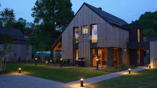 a rendering of a house with lights in the yard at Rezidence Za Vodou - Ledňáček in Černý Dŭl