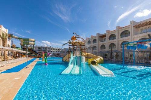 a pool with a water slide in a resort at Sunrise Montemare Resort -Grand Select in Sharm El Sheikh