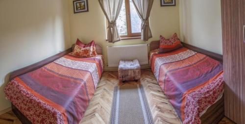 Ένα ή περισσότερα κρεβάτια σε δωμάτιο στο Guest House Balkanski Kat