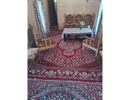 an aerial view of a living room with a red rug at House Boat Moti Mahal, Srinagar in Srinagar