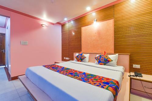 a bedroom with a large bed in a room at FabHotel Fly View in Jaipur