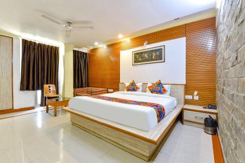 a bedroom with a large bed in a room at FabHotel Fly View in Jaipur