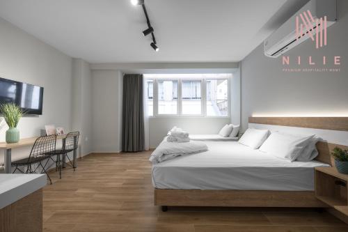 Posteľ alebo postele v izbe v ubytovaní Ultima, Nilie Hospitality MGMT