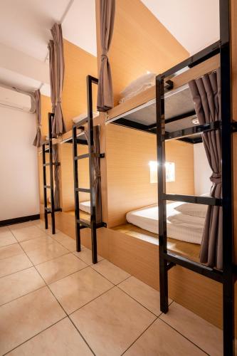 a room with two bunk beds in a hostel at Utopia Hostel in Taitung City