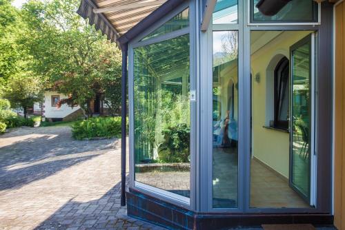 a glass door on the side of a house at Estate Žagmeštri in Ljubno
