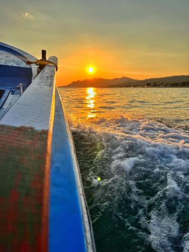 a view from the back of a boat at sunset at Ivonnis Garden in Mesimvría