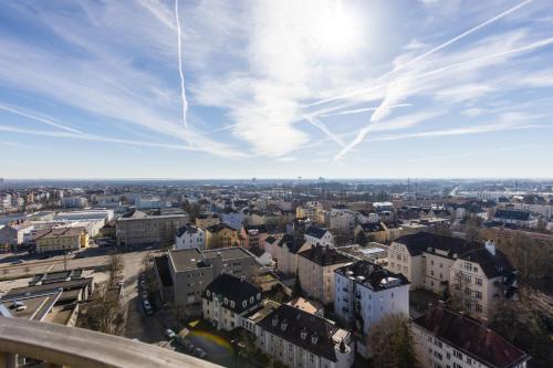 a view of a city with buildings and the sky at Arbio I Balcony Apartments Augsburg in Augsburg