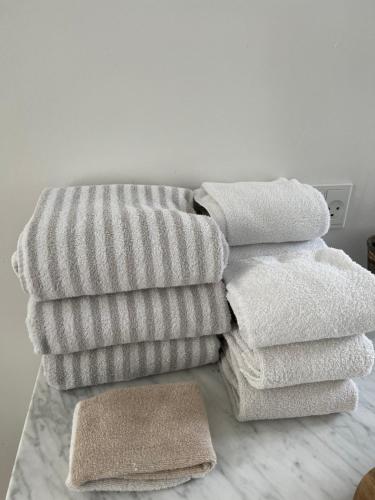 a pile of towels sitting on top of a couch at KøbenhavnK in Copenhagen