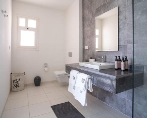 a bathroom with a sink and a mirror at Sea view villa in fouka bay with private pool 21B in Marsa Matruh