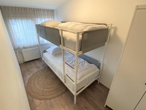 Ένα ή περισσότερα κρεβάτια σε δωμάτιο στο Huisje Cadzand Bad, Wijk de Brabander 157