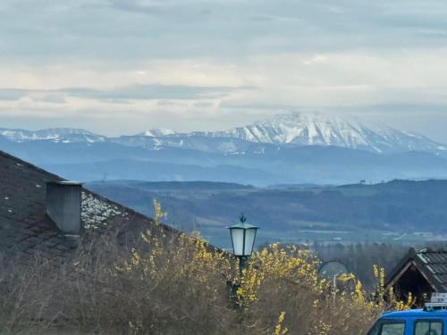 a view of a snow covered mountain with a street light at Urlaub in Schlossnähe in Artstetten