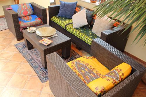 a living room with two chairs and a table at Hotel Residence Le Chiavi Di San Francesco in Trapani