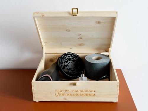 a wooden box with a roll of toilet paper in it at SG9 CITY APARTMENTS in Brescia