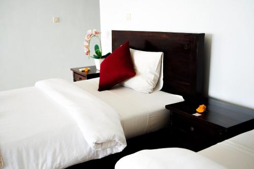 Postel nebo postele na pokoji v ubytování Alam Bali Beach Resort