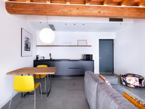 a living room with a couch and a table at SG9 CITY APARTMENTS in Brescia
