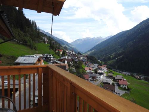 a view from a balcony of a town in the mountains at Holiday home in Kappl Paznauntal 42411 in Kappl