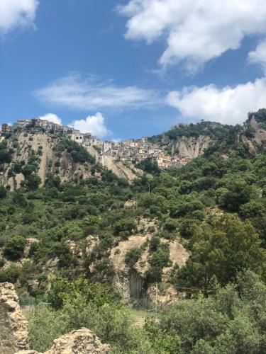 a mountain with a town on top of it at Antico Borgo - A due passi dalle Gole Alcantara in Motta Camastra