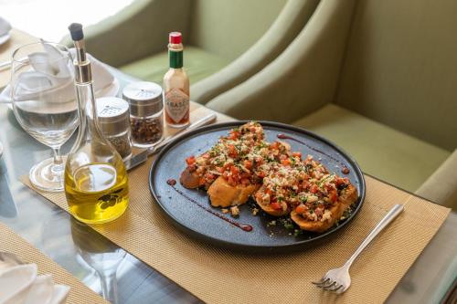 a plate of food sitting on top of a table at Dream International Hotel in Lumbini