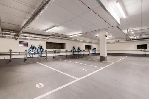 an empty parking lot with bikes in a parking garage at Premier Inn Leipzig City Oper in Leipzig