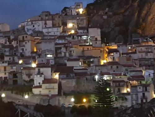 a bunch of buildings on a hill at night at Antico Borgo - A due passi dalle Gole Alcantara in Motta Camastra