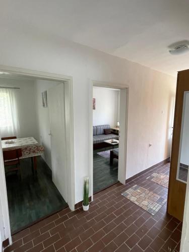 an empty living room with a couch and a table at Apartments Matija in Sutomore