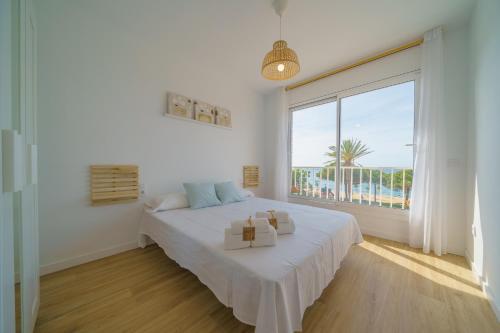 Postel nebo postele na pokoji v ubytování HomeHolidaysRentals Delmare - Costa Barcelona