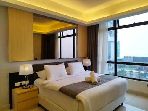a bedroom with a large bed with a large window at TopGenting RedMarbleColdSty2R2B7Pax at GrdIonDelmn in Genting Highlands