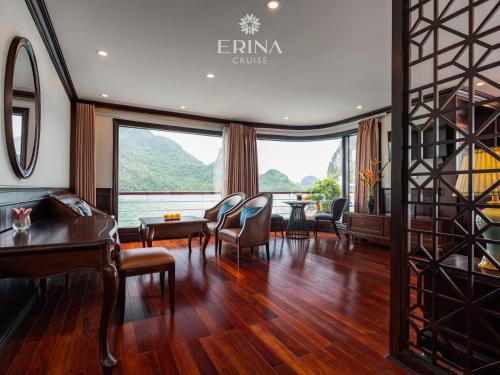 a waiting room with chairs and a table andwindows at Erina Cruise by HAG in Ha Long