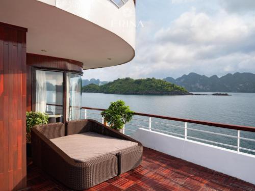 a balcony on a cruise ship looking out at the water at Erina Cruise by HAG in Ha Long