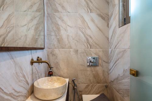 a bathroom with a sink and a shower at Naiades Boutique Hotel - Adults Only in Elounda