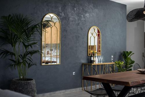 a dining room with a table and a potted plant at SunDaLucky in Afantou